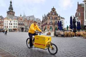 Beeld bij DHL breidt aantal routes met fietskoeriers uit
